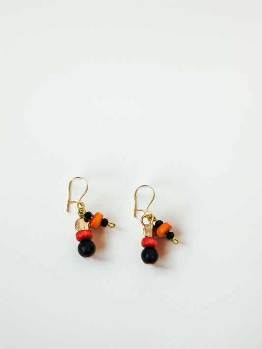 Pair of beaded earrings on a white background