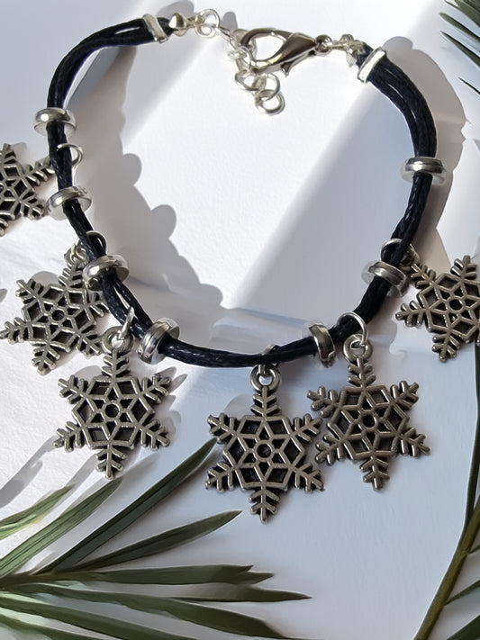 Bracelet with snowflake charms on a white background