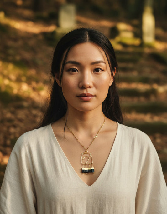 Woman wearing a necklace with a scenic background