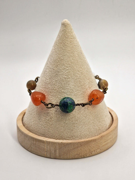 Bracelet with colorful beads on a cone-shaped display stand against a white background